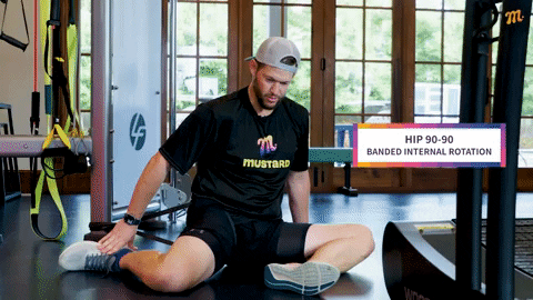 Clayton Kershaw performing hip 90-90 stretch with band