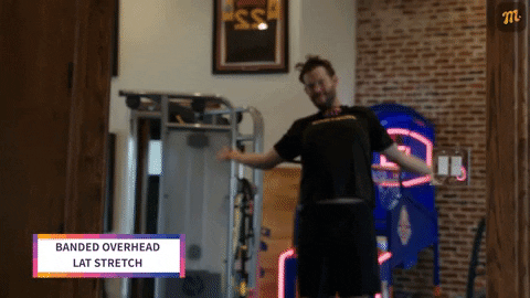 Clayton Kershaw performing banded overhead lat stretch